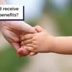 disabled child holding adult hand