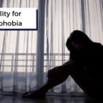 disability for agoraphobia title on person sitting by window