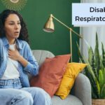 woman on a couch with a respiratory disorder who is having trouble breathing